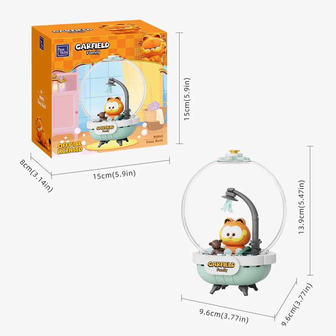 a toy resembling a character from the animated series " Garfield". The toy is a miniature model of a bathtub with a character inside, which appears to be a playful and whimsical representation of the beloved cartoon character. The toy is packaged in a box, and the dimensions of the toy are provided in centimeters and inches.
