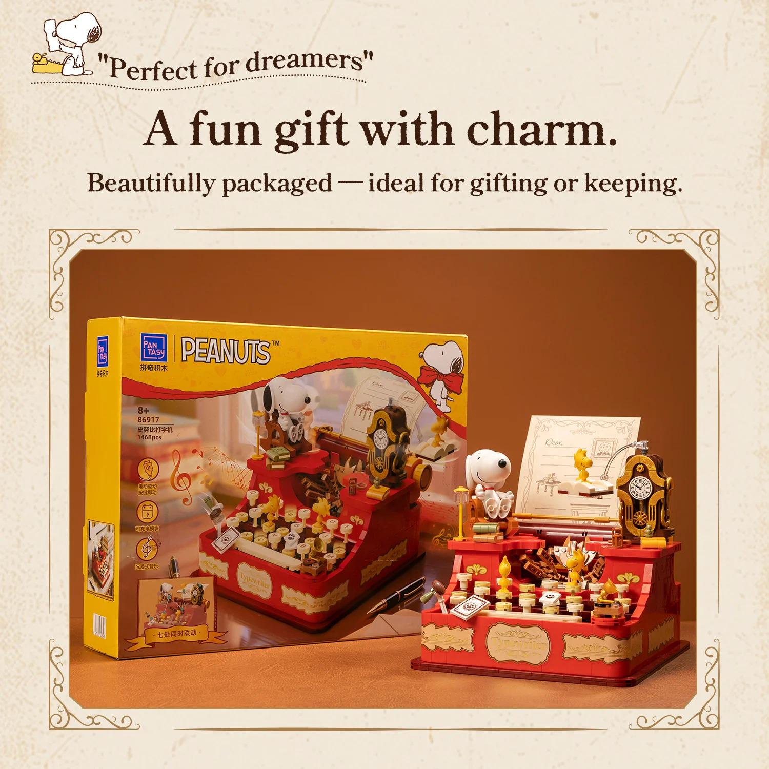 A Peanuts-themed toy piano with a clock and other decorative elements, presented in a decorative box.