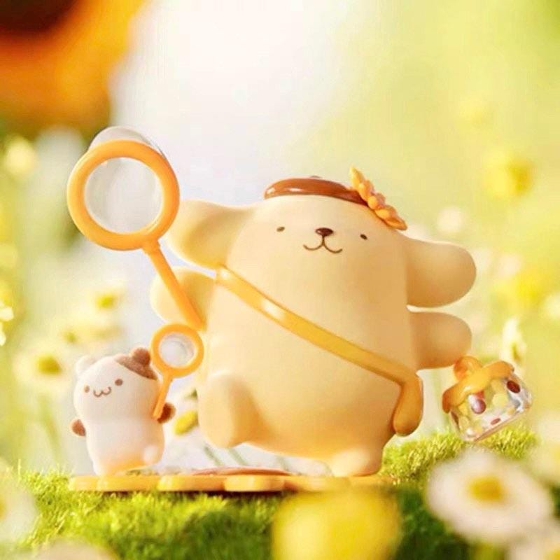 A figurine of a yellow dog-like character with a flower in its hair, holding a magnifying glass, standing on a grassy surface with a small white figurine nearby.
