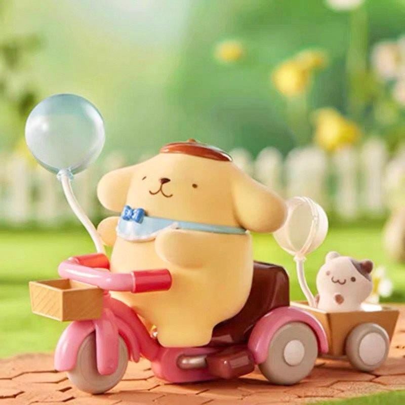 A yellow toy dog is riding a pink toy motorcycle, holding a blue balloon, with a small white dog in a basket attached to the back.
