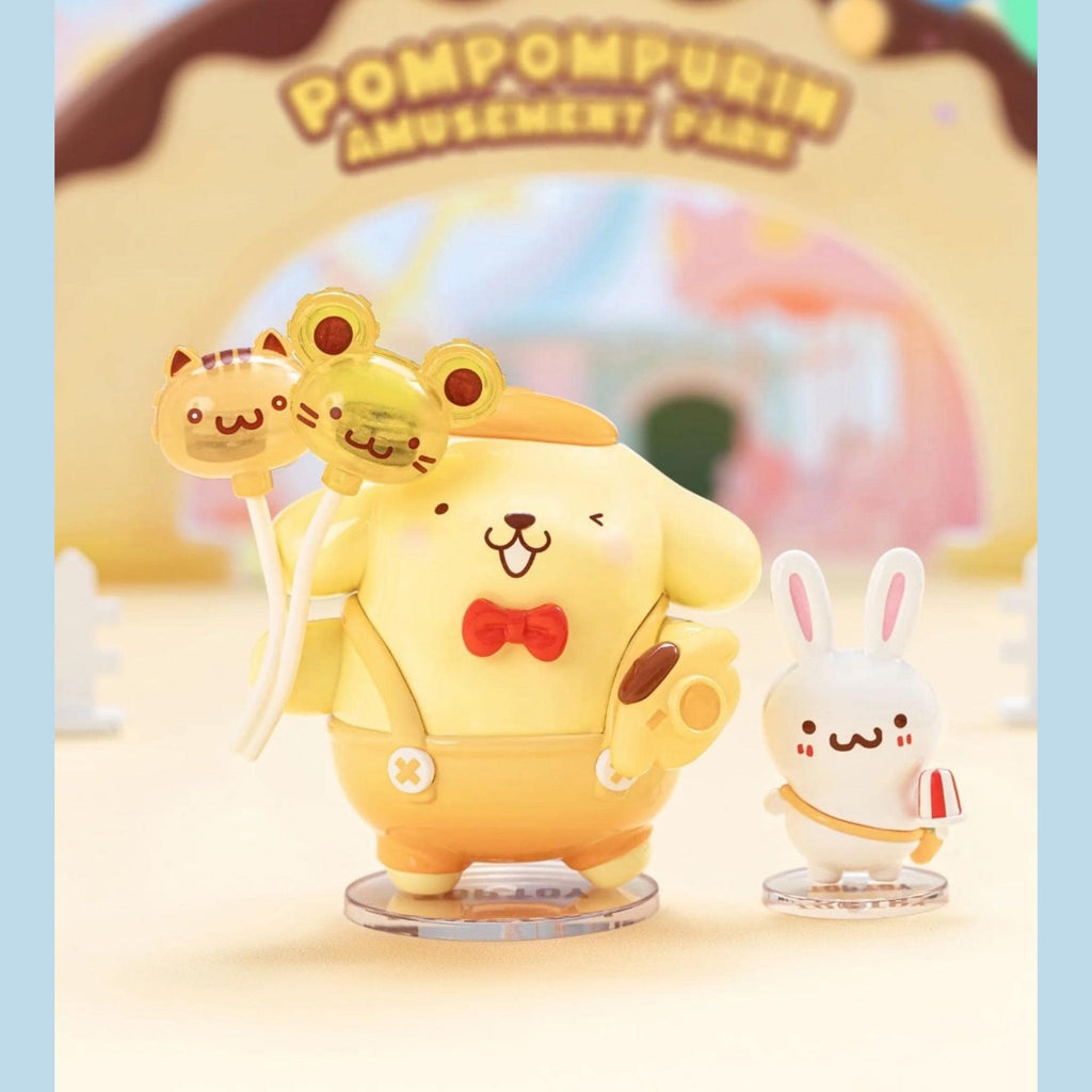 A figurine of a yellow dog wearing a red bow tie, holding a cat and a frog, standing next to a smaller white rabbit figurine.