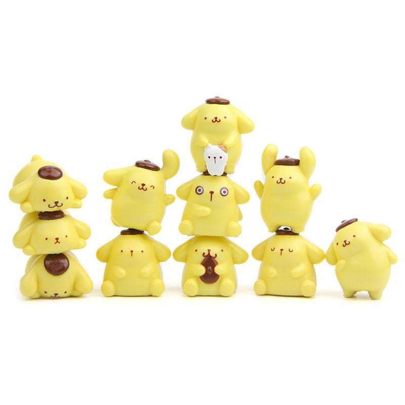 A group of yellow, cartoon-like figurines or toys arranged in a row.