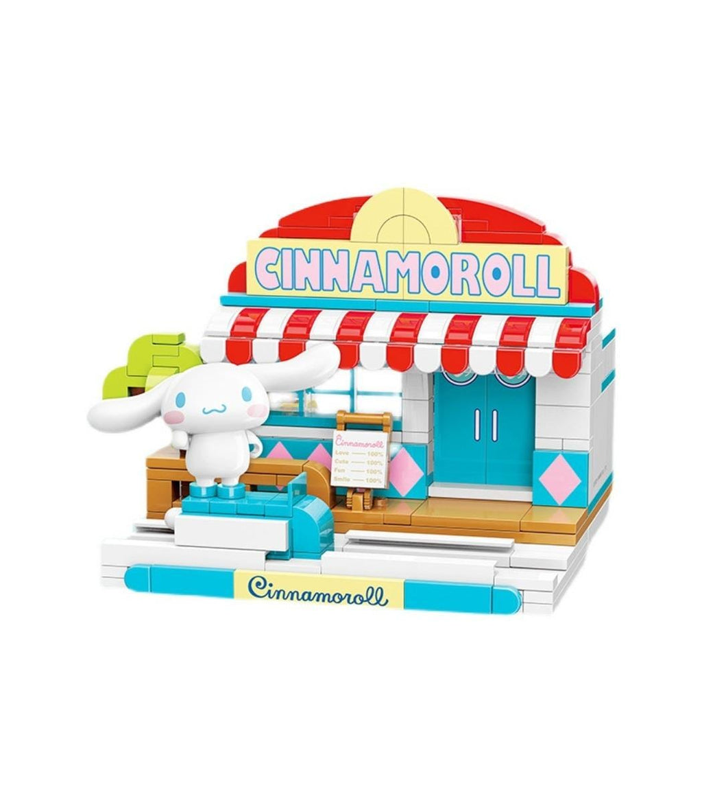 A colorful toy model of a cinnamon roll shop, featuring a cute white character and a red and white striped awning.