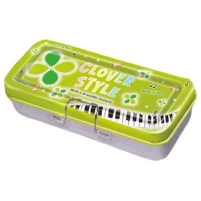 A green tin can with a musical theme, featuring a keyboard and the text "CLOVER STYLE" along with a clover motif.