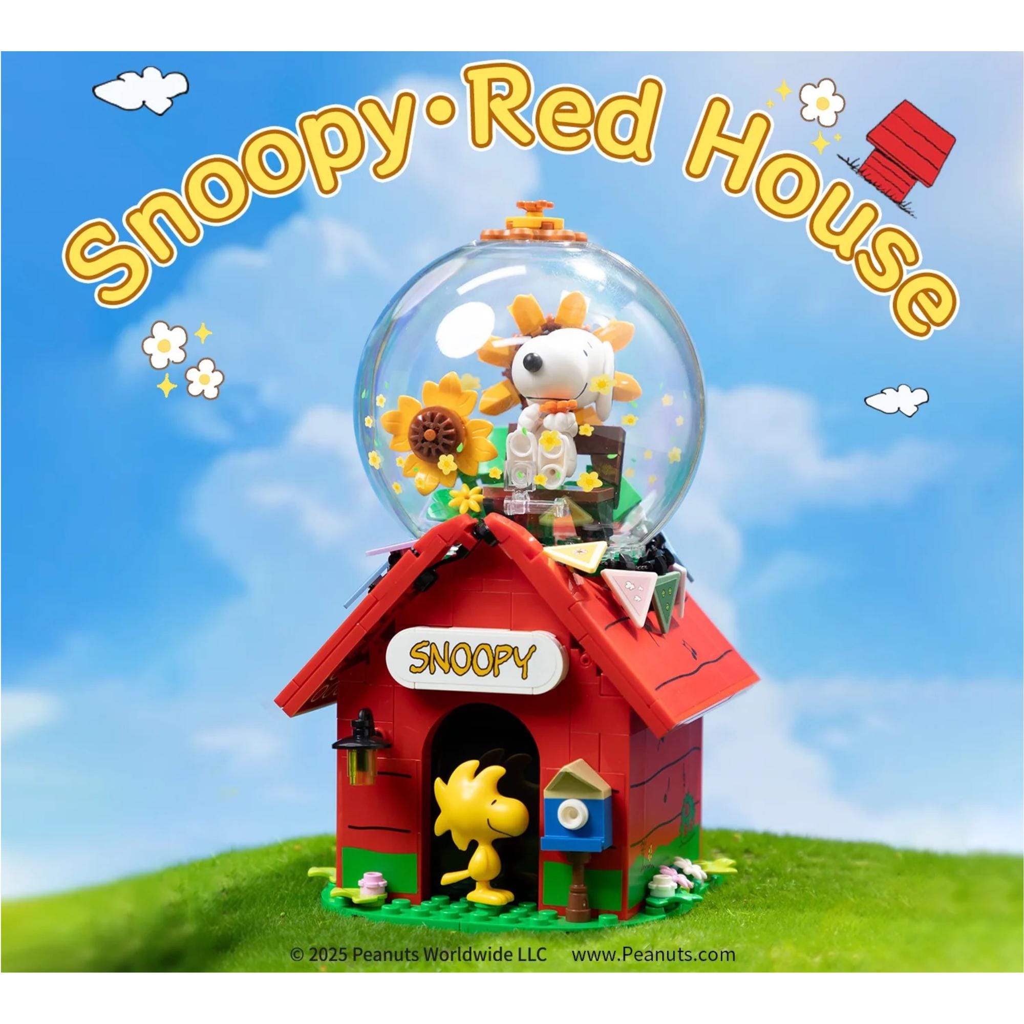 A Lego model of a red house with a glass dome containing a Snoopy figurine and a sunflower, set against a blue sky with clouds.