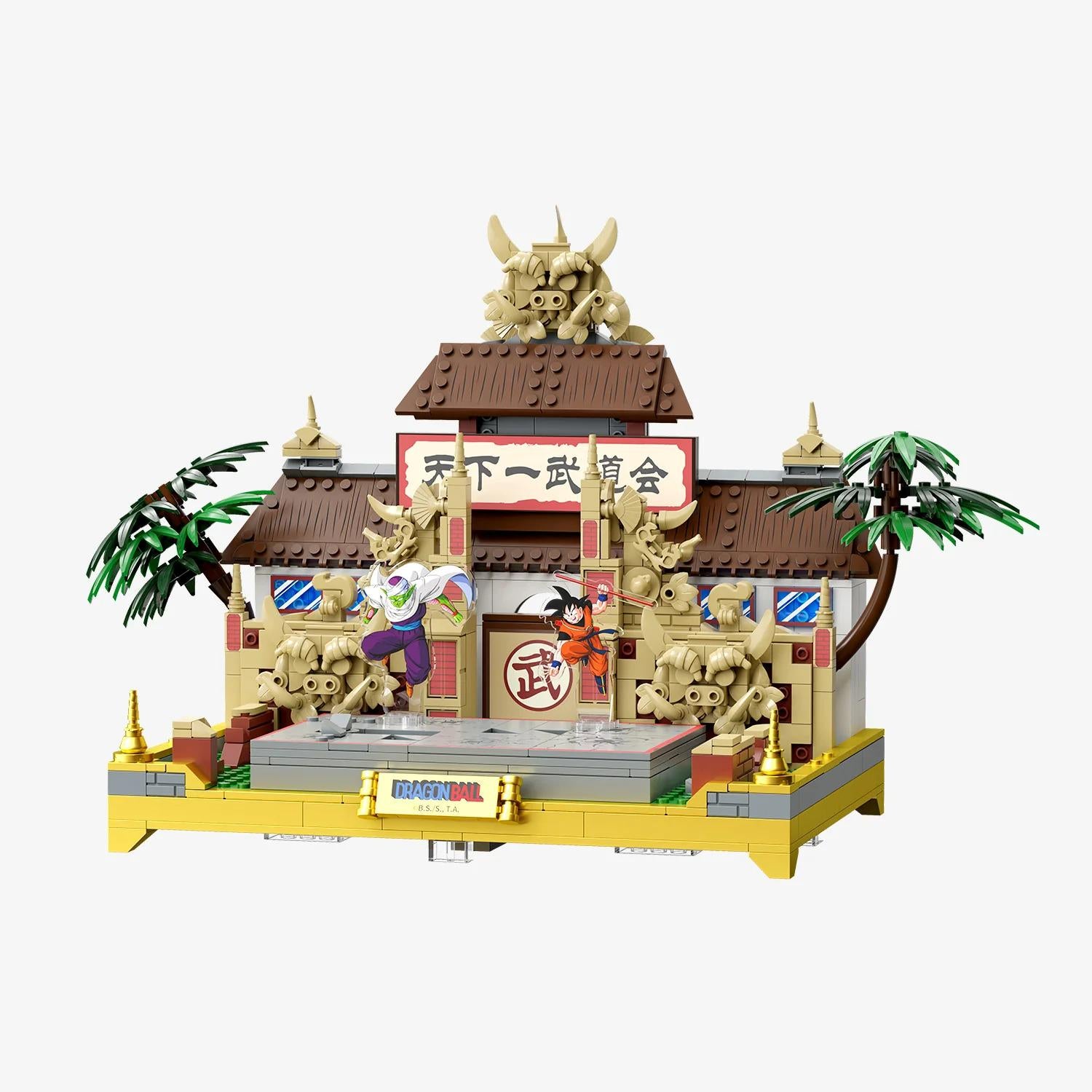A detailed LEGO model of a traditional Japanese temple with intricate decorations and figures, including a dragon and a character, set against a white background.
