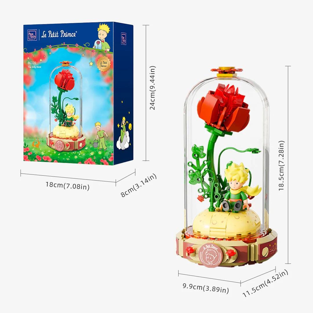 a toy called "Le Petit Prince" with a glass dome containing a red rose and a green plant. The toy is packaged in a box, and the dimensions of the toy are provided.