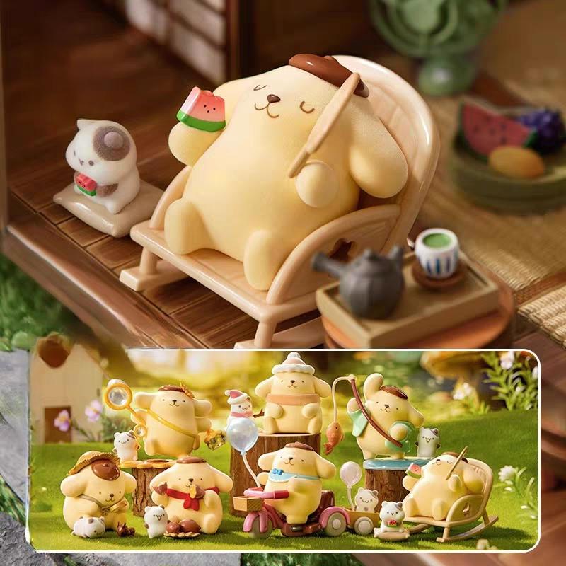 a collection of small, colorful figurines of various animals, including a large yellow bear sitting in a rocking chair, surrounded by smaller figurines of other animals.