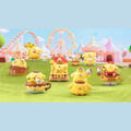 A collection of colorful, whimsical figurines of various animals, including dogs, cats, and birds, set against a vibrant, playful background featuring a ferris wheel and a carnival.