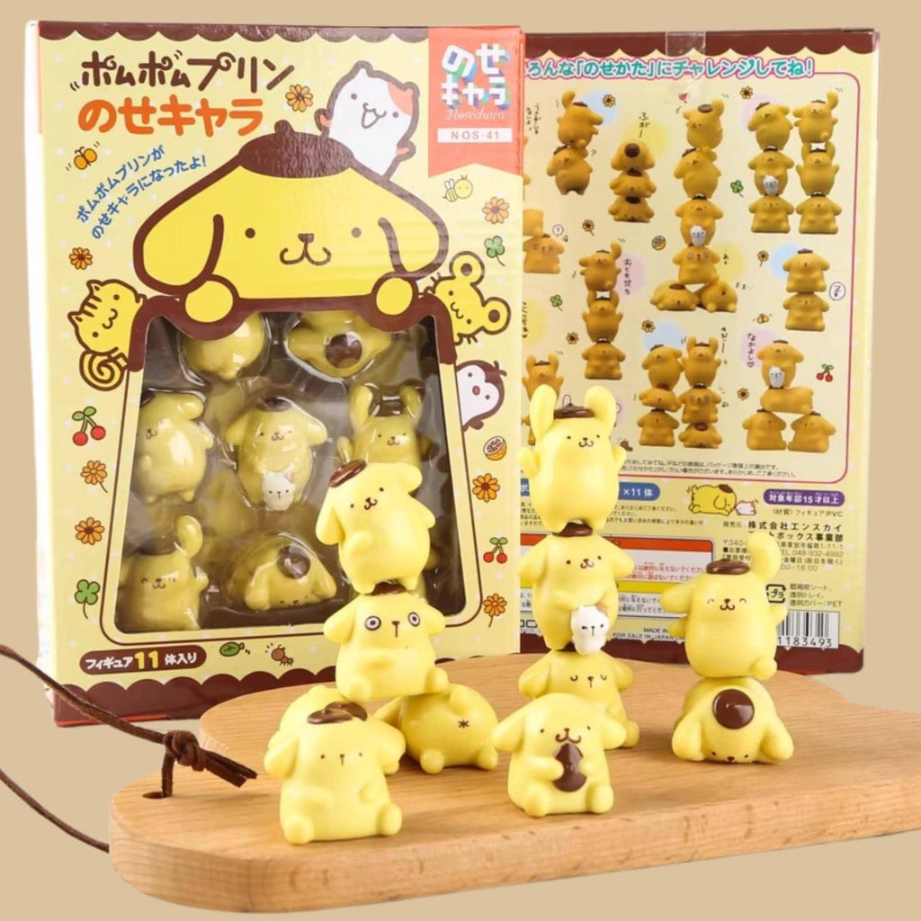 a collection of yellow, cartoon-like figurines, likely representing various animals or characters, displayed on a wooden surface.