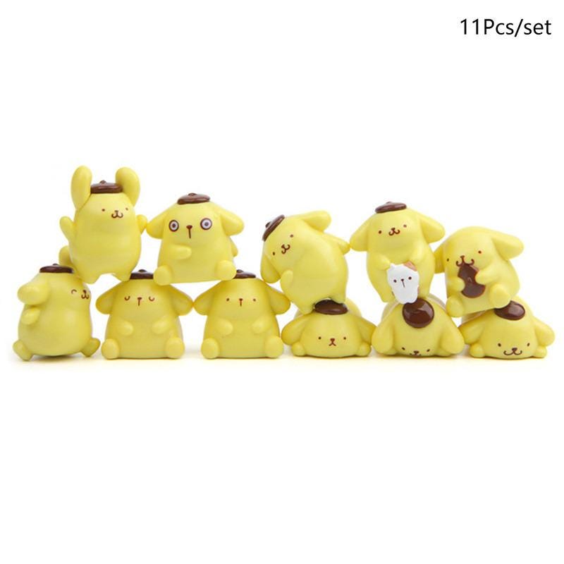 A collection of yellow cartoon animal figurines, including dogs and cats, arranged in a row.