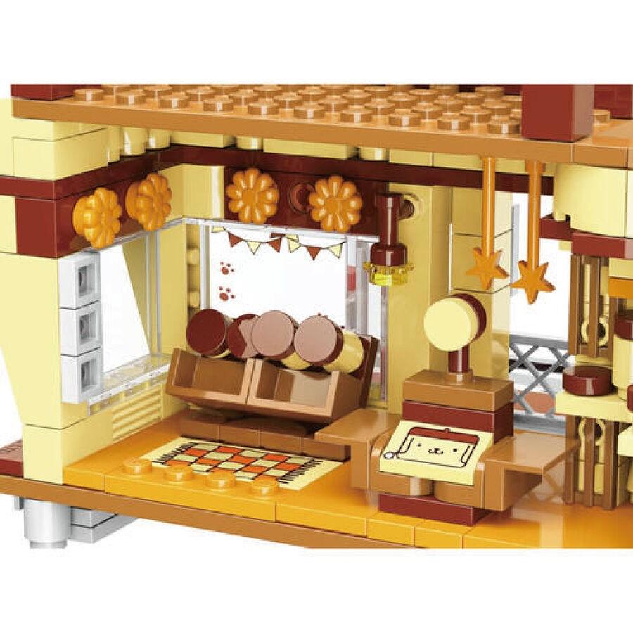 A detailed and colorful toy kitchen set, featuring various pieces such as a sink, stove, and other accessories.