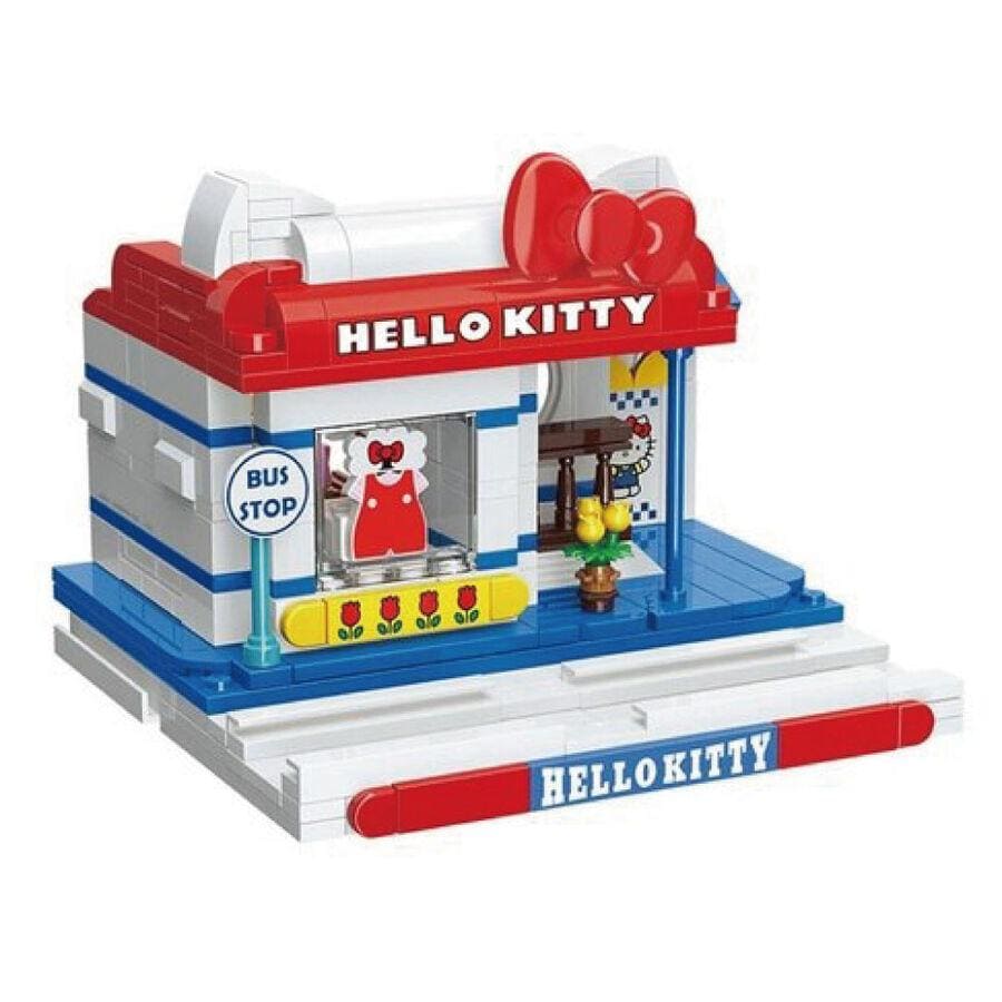 A Hello Kitty-themed toy bus stop with a red roof, white walls, and a "Hello Kitty" sign. The bus stop also has a small window and a flower decoration.