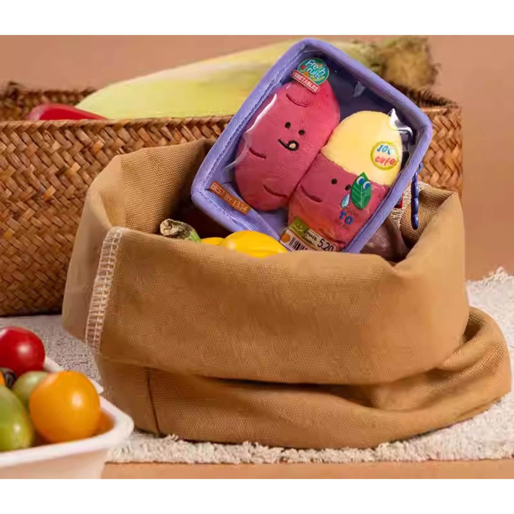 A brown woven basket containing a toy resembling a brain and a yellow toy, along with a bowl of fruit, including bananas and oranges.