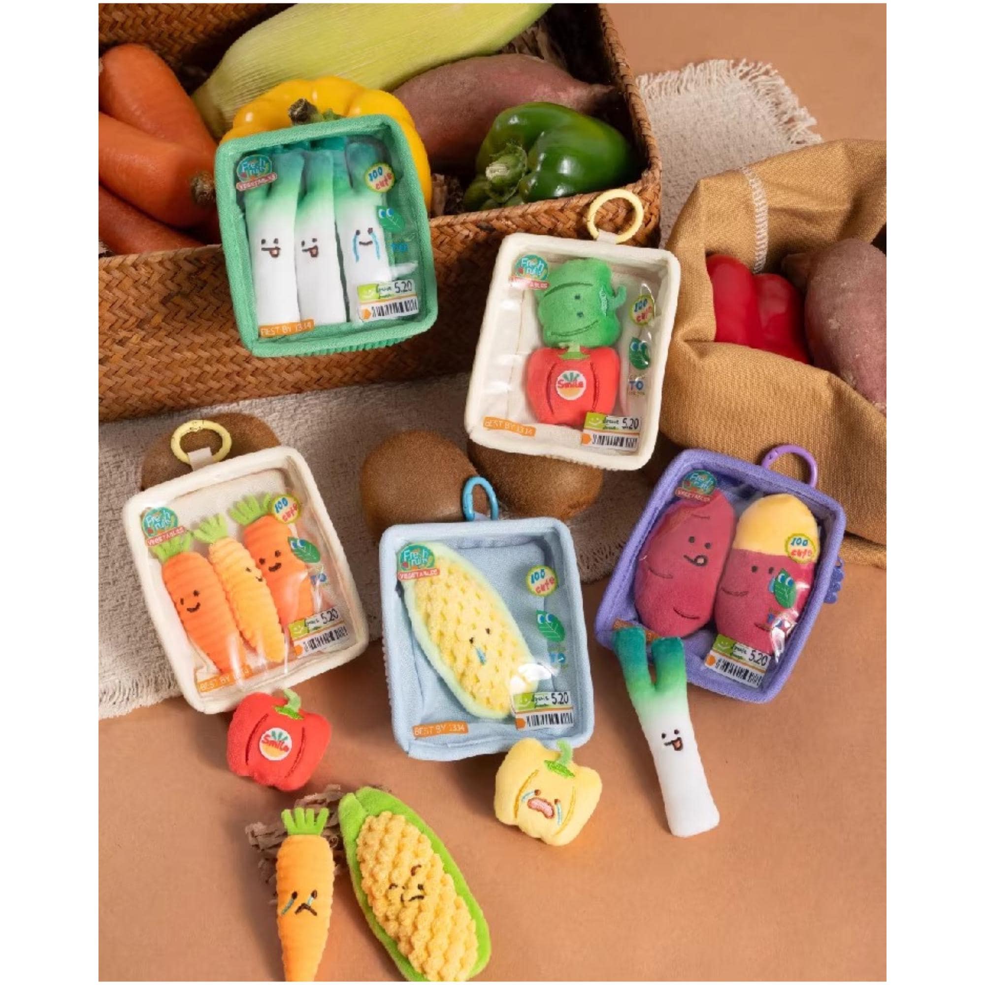 A collection of colorful plush toys depicting various vegetables, including carrots, peppers, and corn, arranged on a surface.
