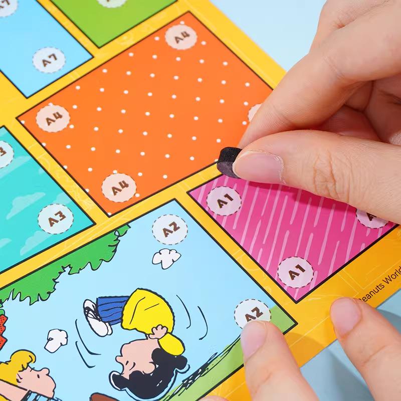 A person's hands are holding a piece of paper with a cartoon character from the Peanuts comic strip, specifically Snoopy, on it.