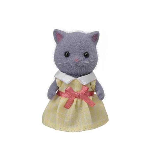 A gray stuffed cat toy wearing a yellow dress with a pink bow.