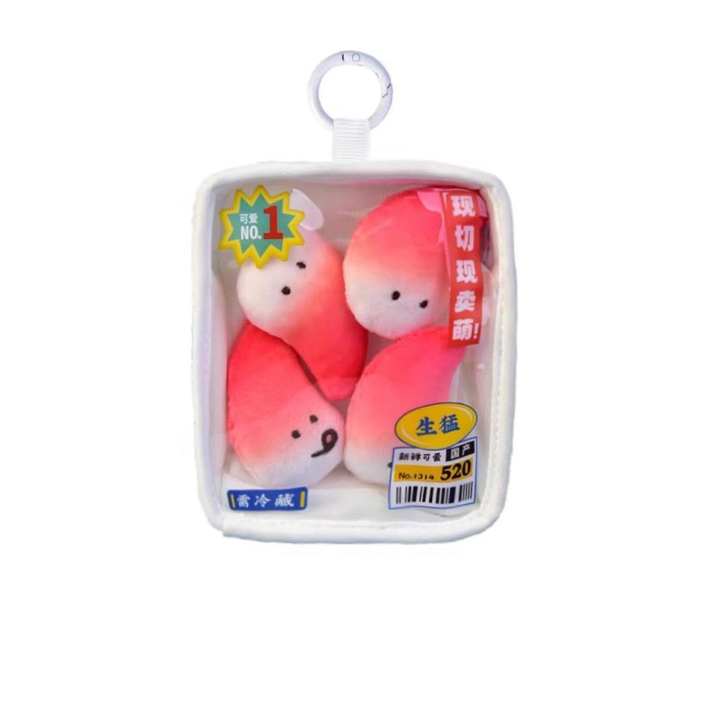 a package containing three pink and white stuffed animals, which appear to be a type of plush toy.
