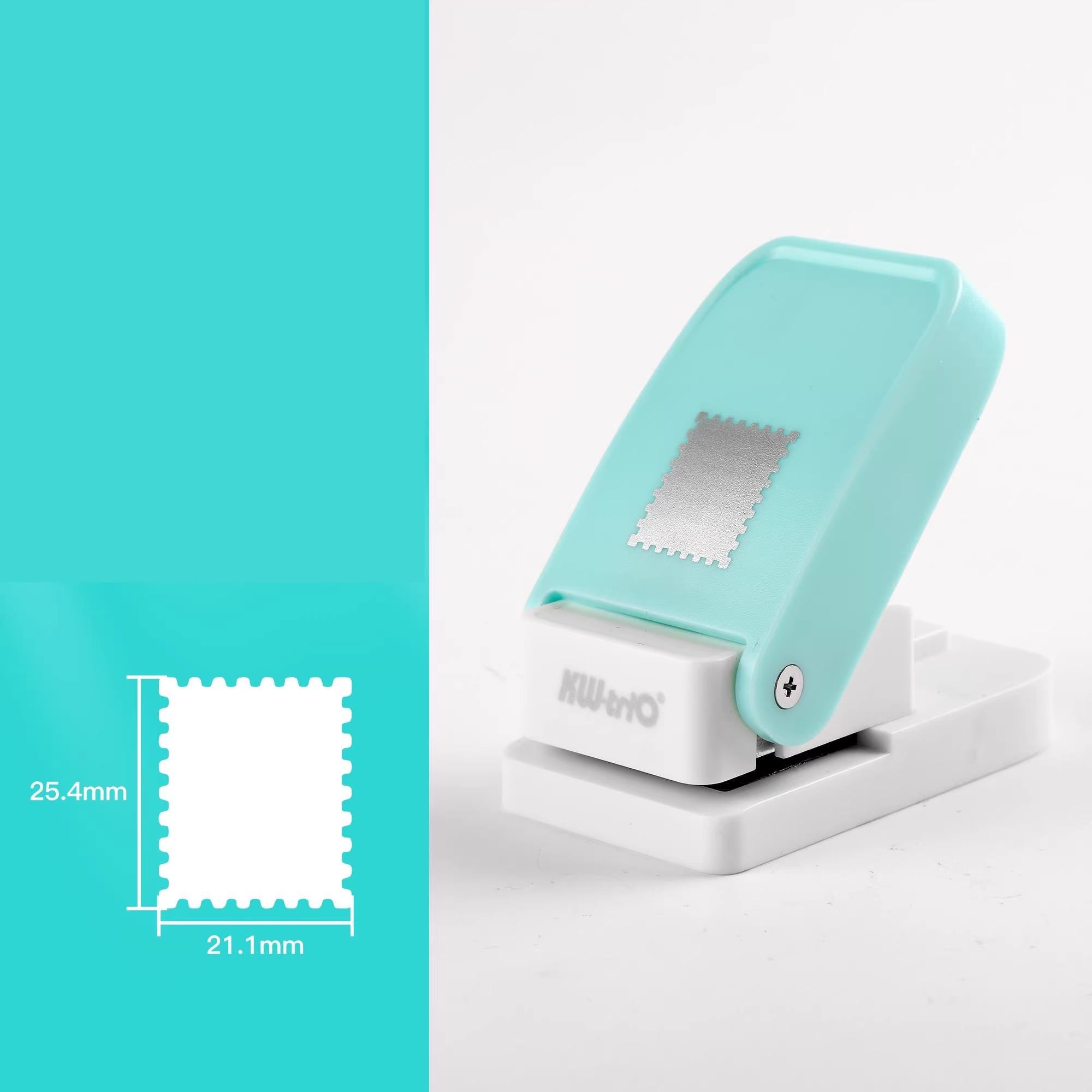 a turquoise and white paper cutter with a silver square on the top.