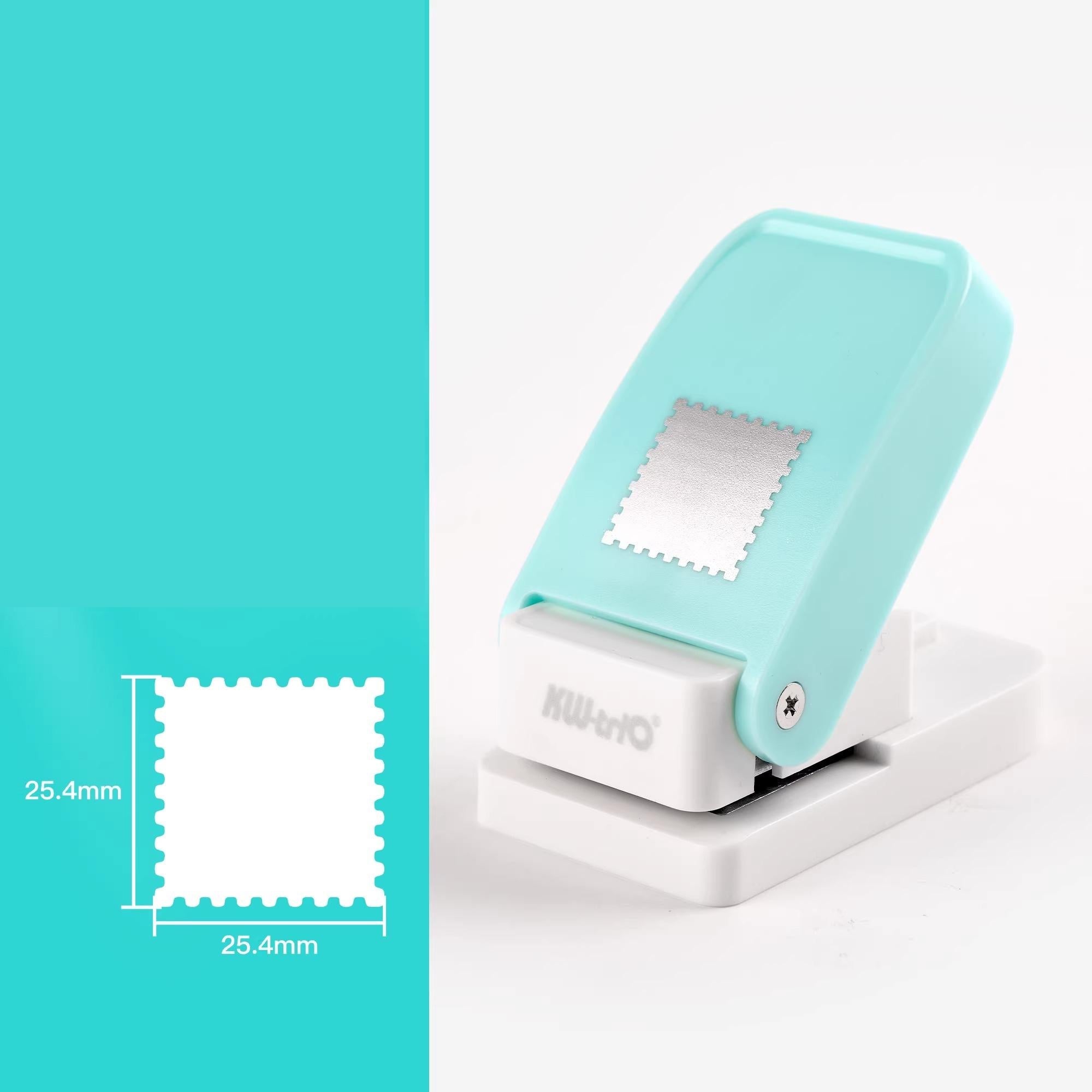 a turquoise-colored object, which appears to be a paper puncher. The object is placed on a white surface, and there is a small square image next to it, likely providing a size reference or a comparison.