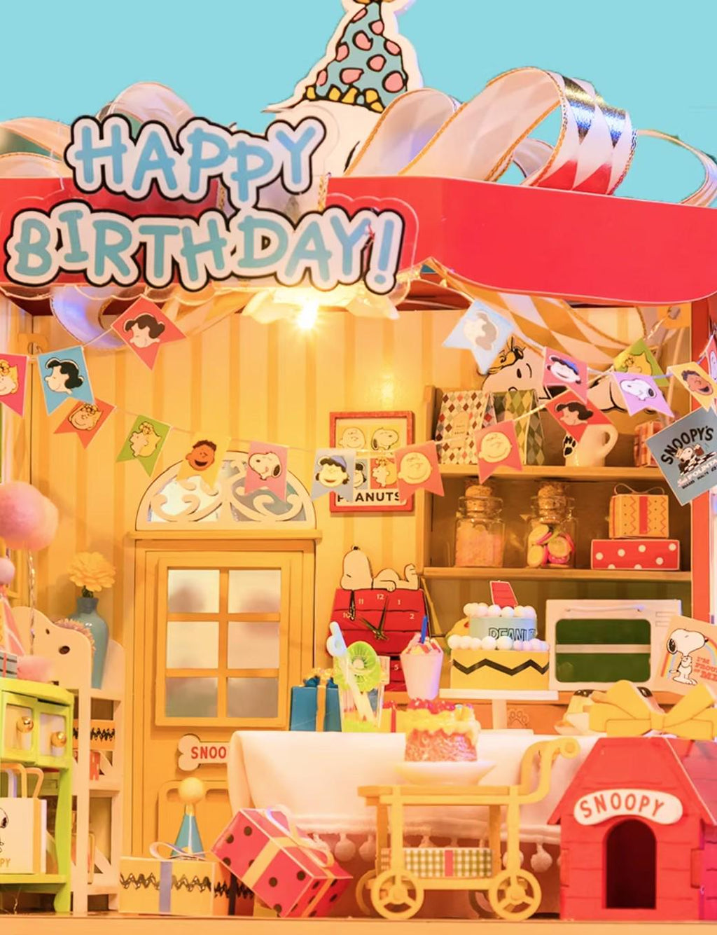 A colorful and whimsical Peanuts-themed birthday party setup, featuring various Peanuts characters and decorations.