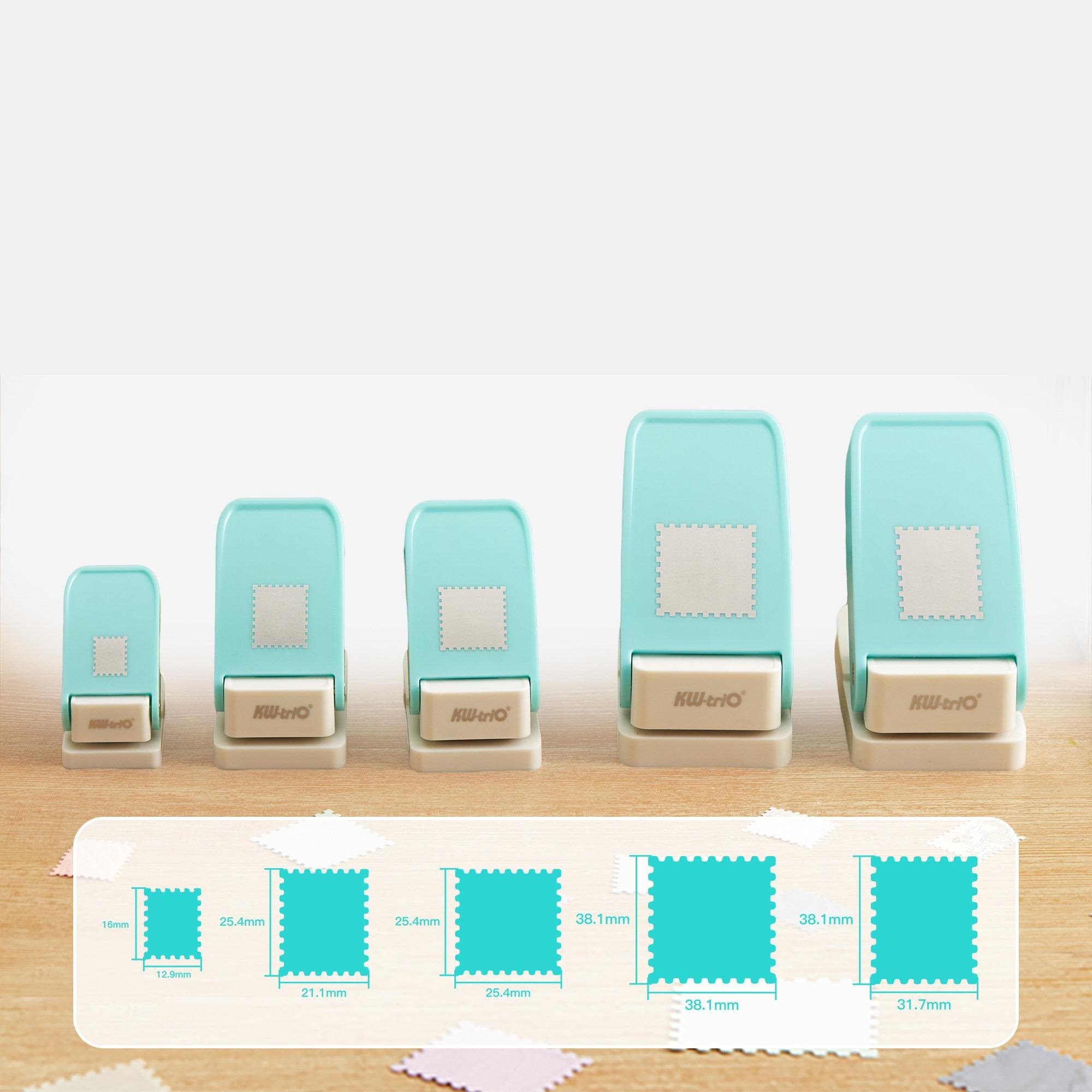A collection of turquoise-colored stamp cutouts arranged on a wooden surface, with a ruler and a series of fabric squares displayed below them.