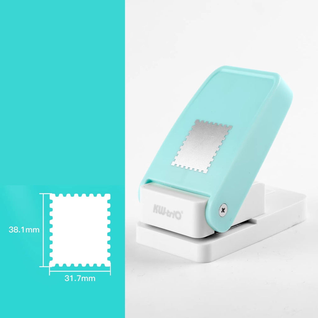 a turquoise-colored object, which appears to be a paper puncher. The object is placed on a white surface, and there is a small square image next to it, providing a size reference. The object is described as having a 38.1 mm (31.7 mm) width and a square-shaped piece, indicating that it is a paper puncher designed to hold and punch paper.