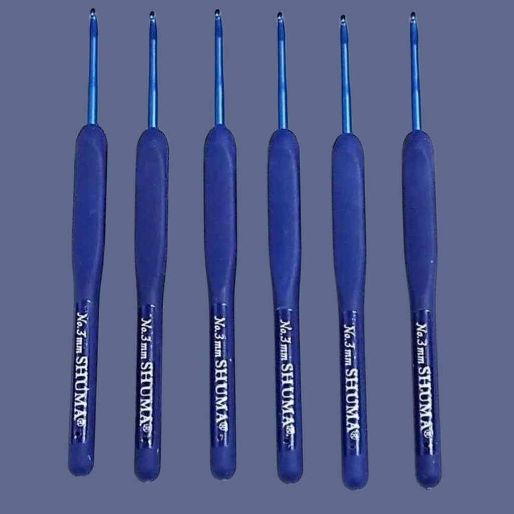 A group of six blue crochet hooks arranged in a row against a dark background.