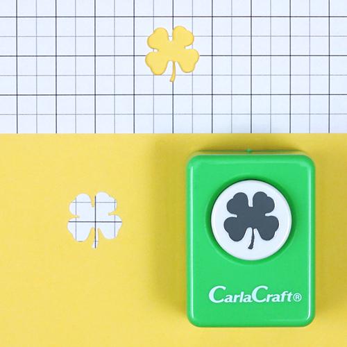 A green punching card labeled "CarlaCraft" is shown next to a yellow background with a white grid pattern.