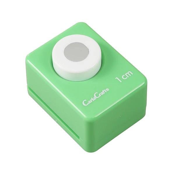 A green push button device with a white circular button on top.