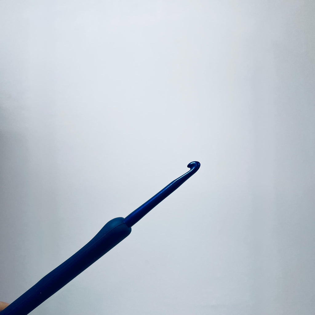 A blue crochet hook is shown against a plain white background.