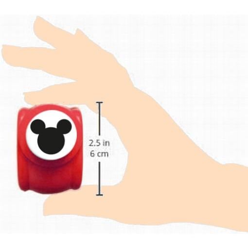A hand holding a red object with a Mickey Mouse face on it.