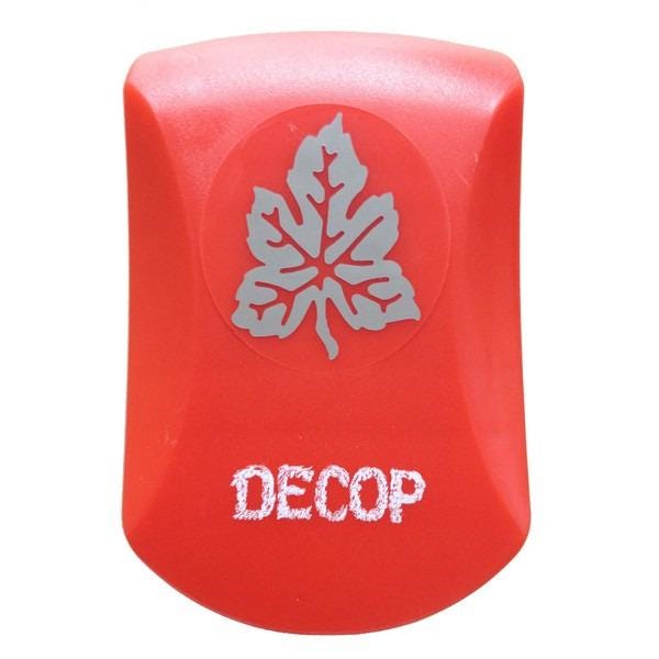 A red plastic object with a leaf-shaped design on it, and the word "DECOP" written on it.