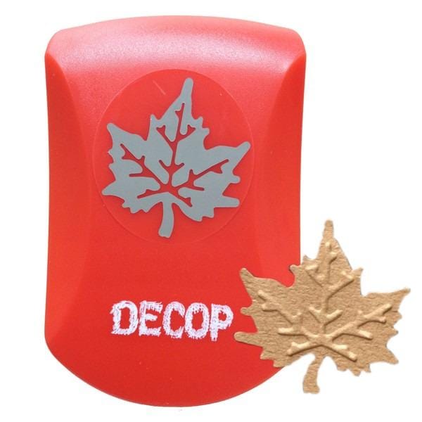 A red plastic object with a white leaf design on it, and the word "DECOP" written on it.
