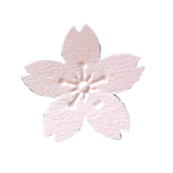 A single pink paper flower with five petals.