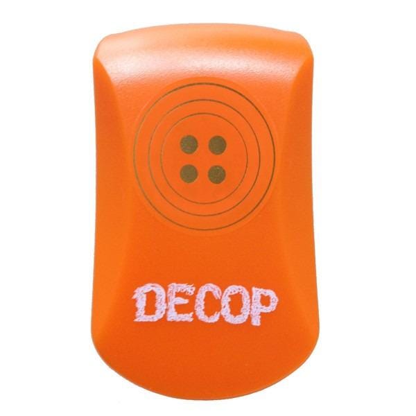 An orange object with a button-like design and the word "DECOP" printed on it.