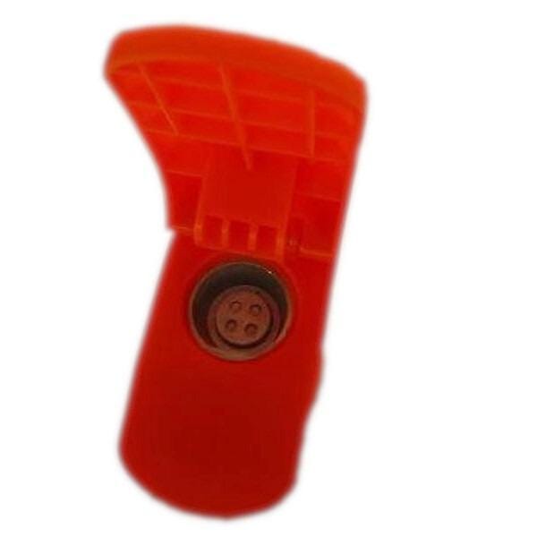 a red plastic object with a small circular button or connector in the center.