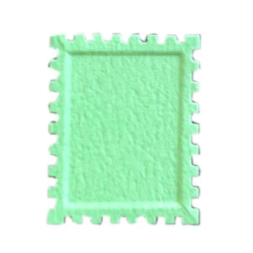A green, square-shaped object with a textured surface, resembling a stamp or a similar item.