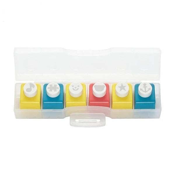 A plastic container with six colorful push pins in it.