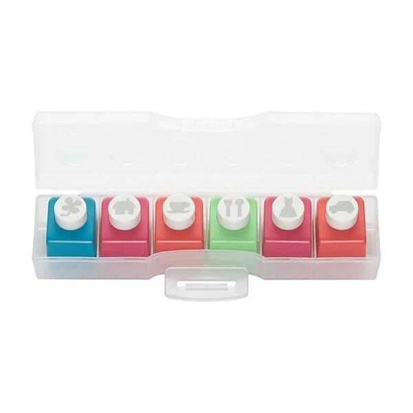 A plastic container with six colorful push pins of different shapes and sizes, arranged in two rows of three.