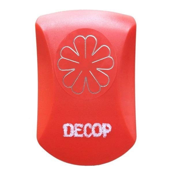 A red plastic object with a white flower-like design on it, and the word "DECOP" written on it.