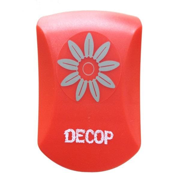 A red object with a white flower design on it, and the word "DECOP" written on it.