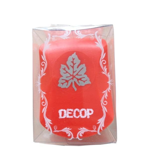 A red candle in a clear plastic container with a white leaf design and the word "DECOP" printed on it.