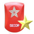a red object with a white star and the word "DECOP" written on it. Next to the red object is a yellow star.
