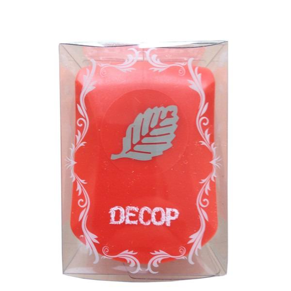a red container with a white leaf design and the word "DECOP" written on it.