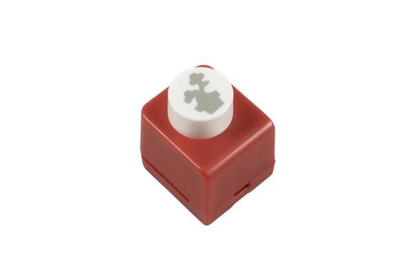A red plastic object with a white circular design on it.