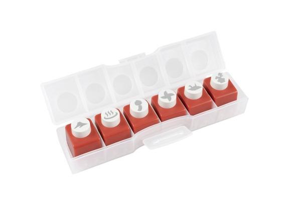 A plastic container with a clear lid, containing six red plastic stamping blocks with white circular designs on them.