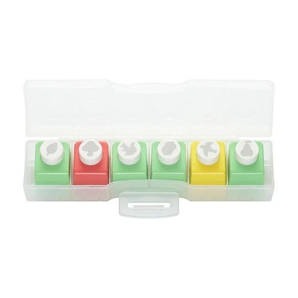 A plastic container with six colorful push pins in it.