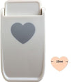A white plastic object with a heart-shaped cutout on it, along with a smaller heart-shaped cutout indicating its size.