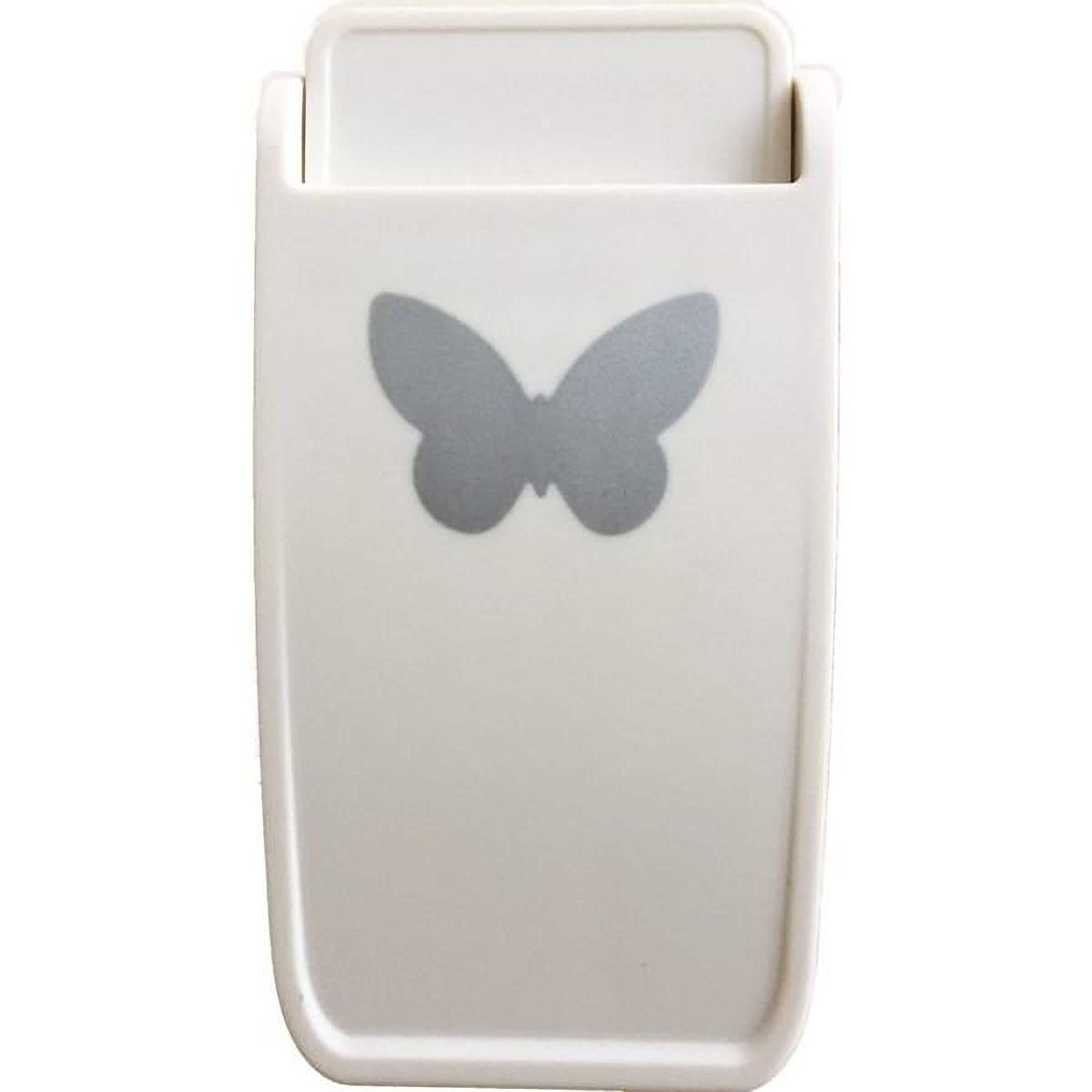 a white object with a silver butterfly design on it.